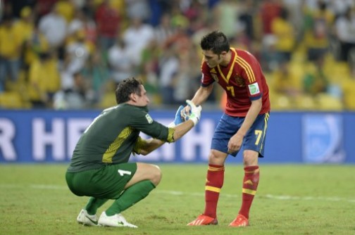 We are sorry: Spain's David Villa appears telling Tahiti keeper, Mikael Roche after the match