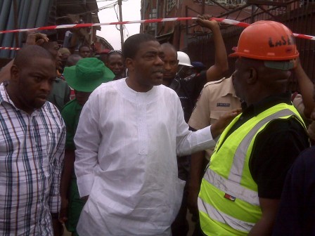 Senator G.O. Solomon on Wednesday at the scene of a collapsed building in Mushin, Lagos.