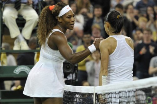 US player Serena Williams (L) shakes hands with Japan's Kimiko Date-Krumm (R) after beating her in their third round women's singles match on day six of the 2013 Wimbledon Championships tennis tournament at the All England Club in Wimbledon, southwest London, on June 29, 2013. Williams won 6-2, 6-0.  AFP 