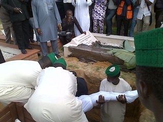 The last rite: laying the body in the grave