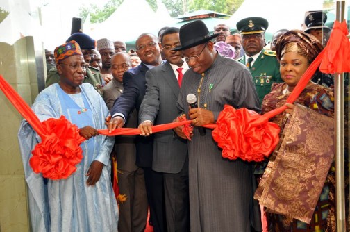 PRESIDENT GOODLUCK JONATHAN ()CUTTING THE TAPE TO INAUGURATE THE NEW CHANCERY BUILDING AT THE NIGERIAN EMBASSY IN BEIJIN CHINA ON THURSDAY (11/7/13) WITH HIM ARE: FROM LEFT: NIGERIA AMBASSADOR TO CHINA, AMB AMINU WALI; GOVERNORS THEODORE ORJI OF ABIA; PETER OBI OF ANAMBRA; ISA YUGUDA OF BAUCHI AND THE FIRST LADY, DAME PATINCE JONATHAN (R).