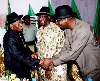Sunny Smiles: President Jonathan shakes hands with Chibudom . Factional Chairman of PDP in Rivers, Obuah watches in broad smiles