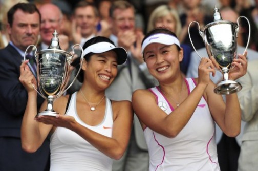 China's Peng Shuai (R) and Taiwan's Hsieh Su-Wei (L) pose with the winners trophies after beating Australia's Ashleigh Barty and her partner Australia's Casey Dellacqua in the women's doubles final