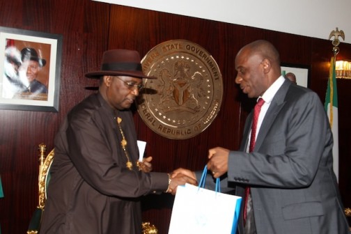 Amaechi presents a gift to Chief Bozimo, Chairman NYSC Governing Board