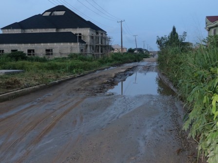 another view of Road 14, first entrance to Lekki Phase 2. There are four gullies on the road and residents cannot use it when it rains