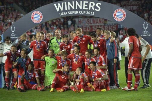 Bayern Munich's players celebrate after the UEFA Super Cup football match FC Bayern Munich vs Chelsea FC on August 30, 2013 at the Eden Stadium, in Prague. AFP 