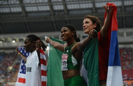 (L-R) Winner US Brittney Reese, silver medallist Nigeria's Blessing Okagbare and bronze Serbia's Ivana Spanovic pose after the women's long jump final at the 2013 IAAF World Championships at the Luzhniki stadium in Moscow on August 11,
