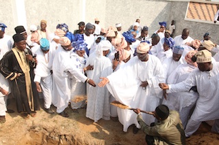 Last rite- Fashola performs the dust to dust rite at the graveside for his father