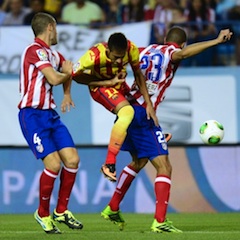 Barcelona's Brazilian forward Neymar da Silva Santos (C) vies with Atletico Madrid's midfielder Mario Suarez (L) and Atletico Madrid's Brazilian defender Joao Miranda de Souzaduring the Spanish Super Cup first leg football match