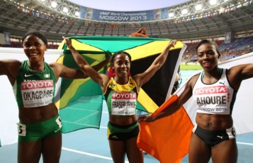 (L-R) Bronze medallist Nigeria's Blessing Okagbare, winner Jamaica's Shelly-Ann Fraser-Pryce and silver medallist Ivory Coast's Murielle Ahoure pose after the women's 200 metres final at the 2013 IAAF World Championships at the Luzhniki stadium in Moscow on August 16, 2013. AFP PHOTO