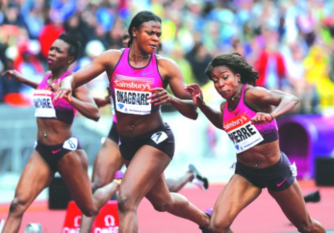 Blessing Okagbare of Nigeria (2-R) stretches to cross the line in the womens 100 metres event during the London Anniversary Games International Association of Athletics Federations (IAAF) Diamond League International Athletics championships at the Olympic Stadium in London on 27 July, 2013. AFP PHOTO