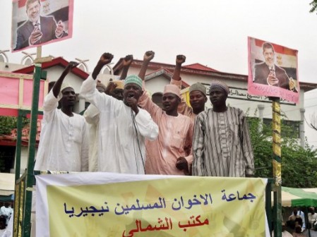 Muslim protesters chant pro-Morsi slogans from a podium on August 24, 2013 in the premises of Sheikh Ahmad Tijjani mosque in northern Nigeria's largest city of Kano during a demonstration to denounce the military crackdown on pro-Morsi supporters from the Muslim Brotherhood in Egypt and calling for his reinstatement.   AFP 
