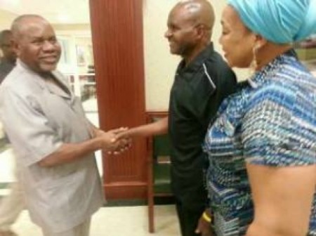 Suntai, (far right)with his wife, shaking hands with acting governor