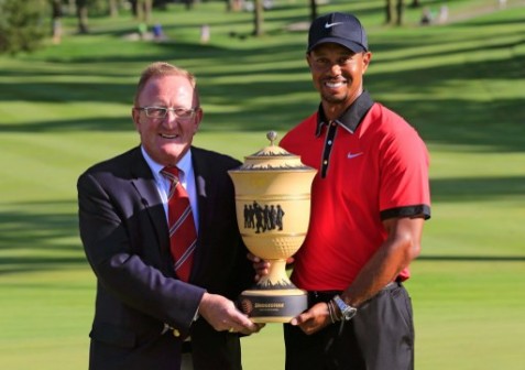 Ryder Cup Director Richard Hills (L) poses with Tiger Woods after the Final Round of the World Golf Championships-Bridgestone Invitational at Firestone Country Club South Course on August 4, 2013 in Akron, Ohio. Woods won the tournament with a score of -15.   AFP