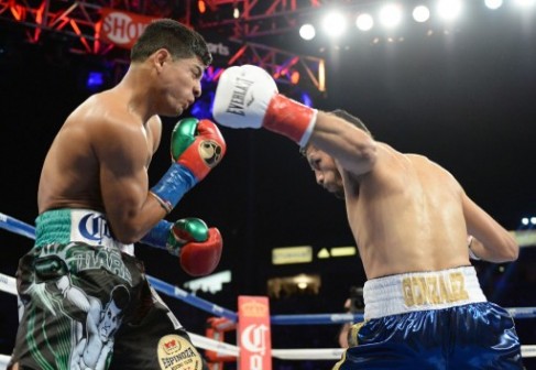 Abner Mares is knocked down by Jhonny Gonzalez during the WBC Featherweight Title Fight at the StubHub Center on August 24, 2013 in Carson, California. Gonzalez would win in a first round konckout.