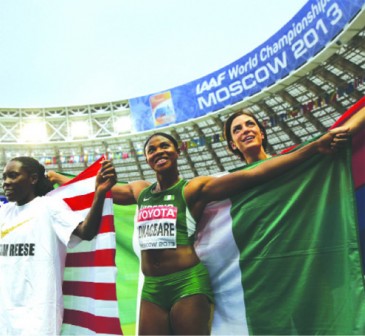 (L-R) Winner US Brittney Reese, silver medallist Nigeria's Blessing Okagbare and bronze Serbia's Ivana Spanovic pose after the women's long jump final at the 2013 IAAF World Championships at the Luzhniki stadium in Moscow on 11 August, 2013. AFP PHOTO.