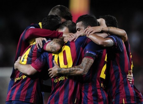 Barcelona players celebrate their first goal against Ajax Wednesday night. AFP photo