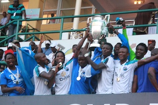 Eyimba players displaying their FA Cup trophy