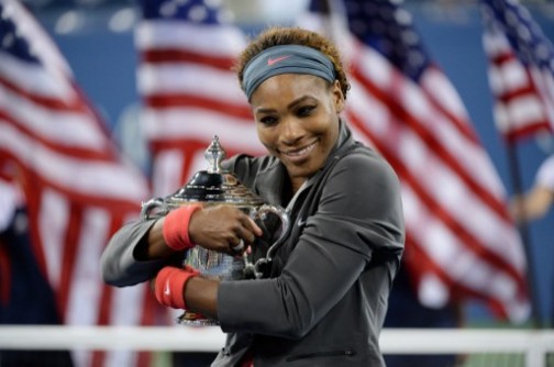 Serena Williams of the US holds the trophy as she celebrates her win over Victoria Azarenka of Belarus during their 2013 US Open women's singles final match at the USTA Billie Jean King National Tennis Center September 8, 2013 in New York. AFP