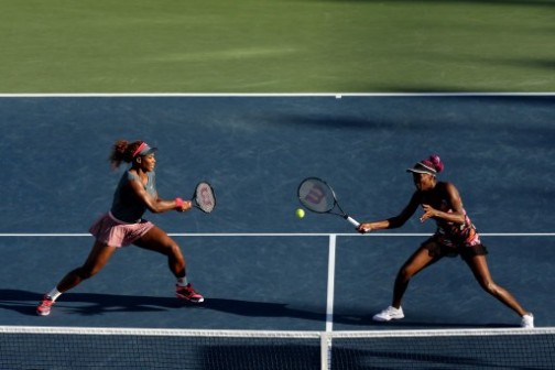 Serena(left) playing doubles with Sister Venus. The pair have qualified for quarter finals