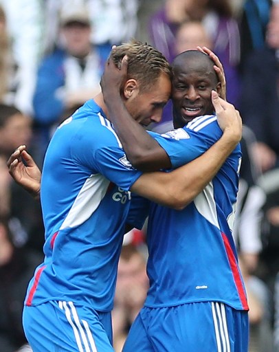 Sone Aluko, right, celebrates winning goal with team mate