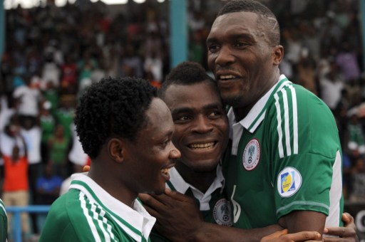 Team mates rejoice with Emenike(middle) for first goal of the match)
