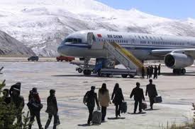 passengers going to board a plane at the world's highest airport