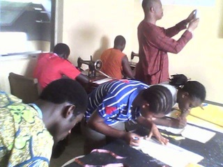youths learning fashion designing at the centre