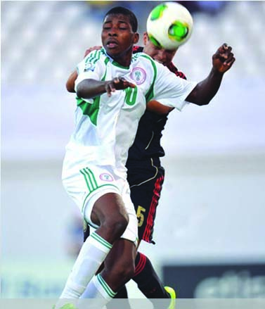 AERIAL BATTLE…Osvaldo Rodriguez of Mexico (left) is challenged by Kelechi Iheanacho of Nigeria