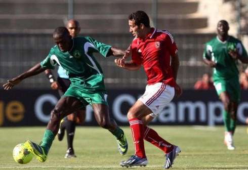 Egypts footballer Mohamed Abou Trika (R) of al-Ahly vies for the ball against Cameroon's Moussa Souleymanou of Coton Sport during their African Champions League semi-final football match at El-Gouna stadium in Hurghada on October 20, 2013. The match ended in sa 1-1 draw. AFP