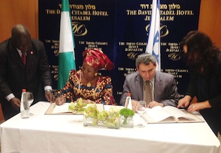 Minister of state in the foreign affairs ministry, Professor Viola Onwuliri, and Israeli deputy foreign minister, MR ZEER ELKIN sign the BASA