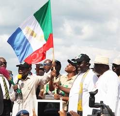 Governor oshiomhole handing over the APC flag to O'tega the candidate for Delta central senatorial candidate