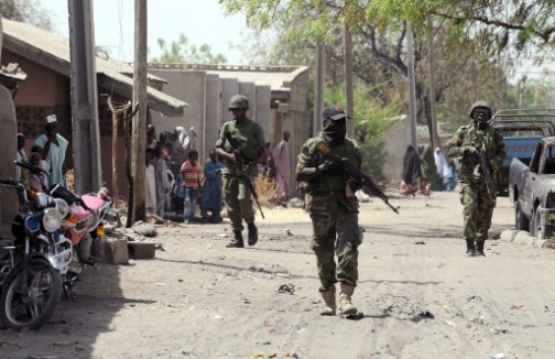 FILE PHOTO: Nigerian soldiers on patrol in a northern town