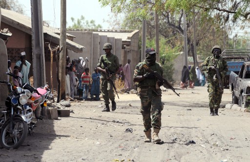Nigerian soldiers on patrol in a northern town