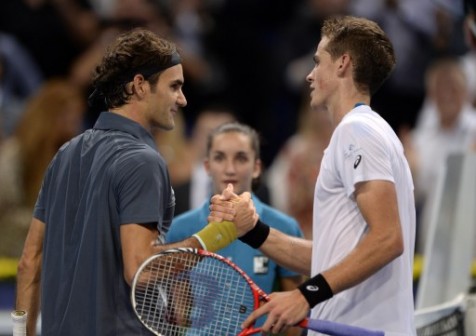 Roger Federer salutes his keen competitor, Vasek Posisil from Canada