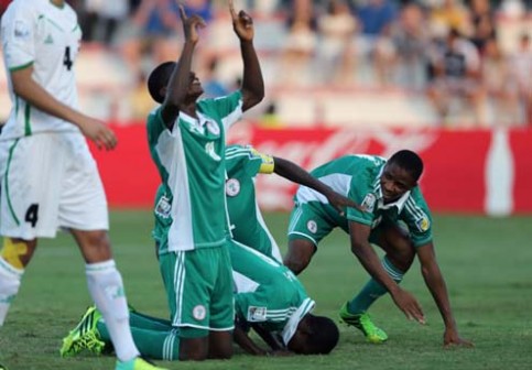 Nigeria's players celebrate after scoring a goal during their FIFA U-17 World Cup UAE 2013 football match Iraq versus Nigeria on October 25, 2013 in Sharjah. AFP PHOTO