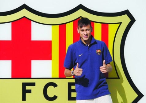 FC Barcelona's new player Brazilian Neymar da Silva Santos Junior gives the thumbs up as he poses for photographers at Camp Nou stadium in Barcelona, on June 3, 2013. Santos and Brazil star Neymar signed a five-year contract with Spanish giants Barcelona. AFP PHOTO/ JOSEP LAGO