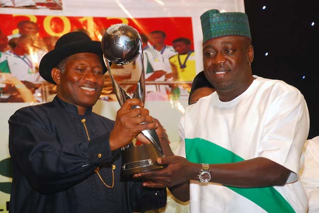 Bolaji Abdullahi presents the FIFA World Cup to Jonathan