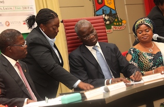 Fashola signs the bond document