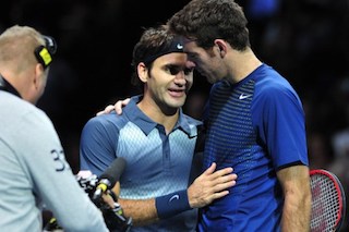 Federer consoles Potro after the match in London ATP finals. AFP Photo
