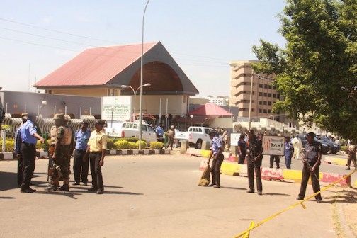 Barred: Policemen and soldiers barricade  the INEC Headquarters gate