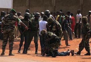CAR peacekeepers trying to control a riotous crowd in Bangui