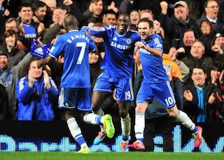 Damba Ba celebrates with Juan Mata