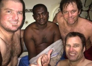 Harrison, middle, with the Dutch divers that rescued him