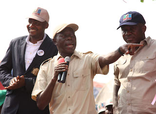 Governor Adams Oshiomhole, Peter Akhugie (left) and Emmanuel Momoh, Chairman, Etsako Central Local Government Area