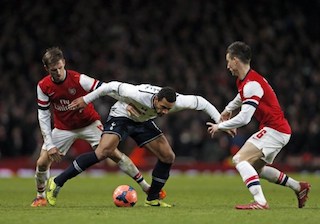 Spurs midfielder Dembele with Arsenal’s defenders