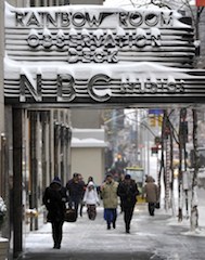 People walk around Rockefeller Center on January 3, 2014 in New York, the morning after the first major winter storm of 2014.