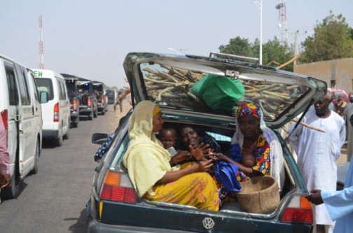 People flee the village of Jakana, outside Maiduguri for fear of Boko Haram