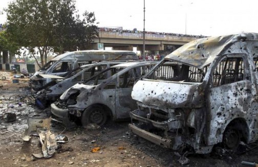 Burnt vehicles at the scene of the 14 April bombing