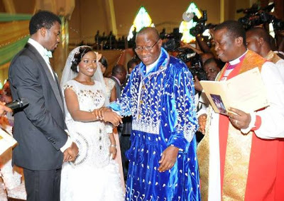HERE COMES THE BRIDE: President Jonathan walks his daughter down the aisle